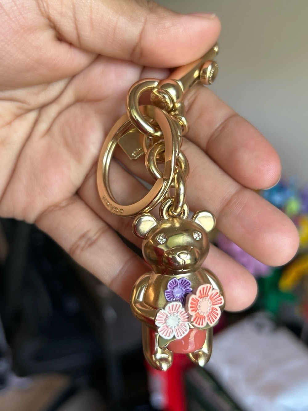 Coach Gold Bear Keychain with Pink, Purple and Orange Floral Accents